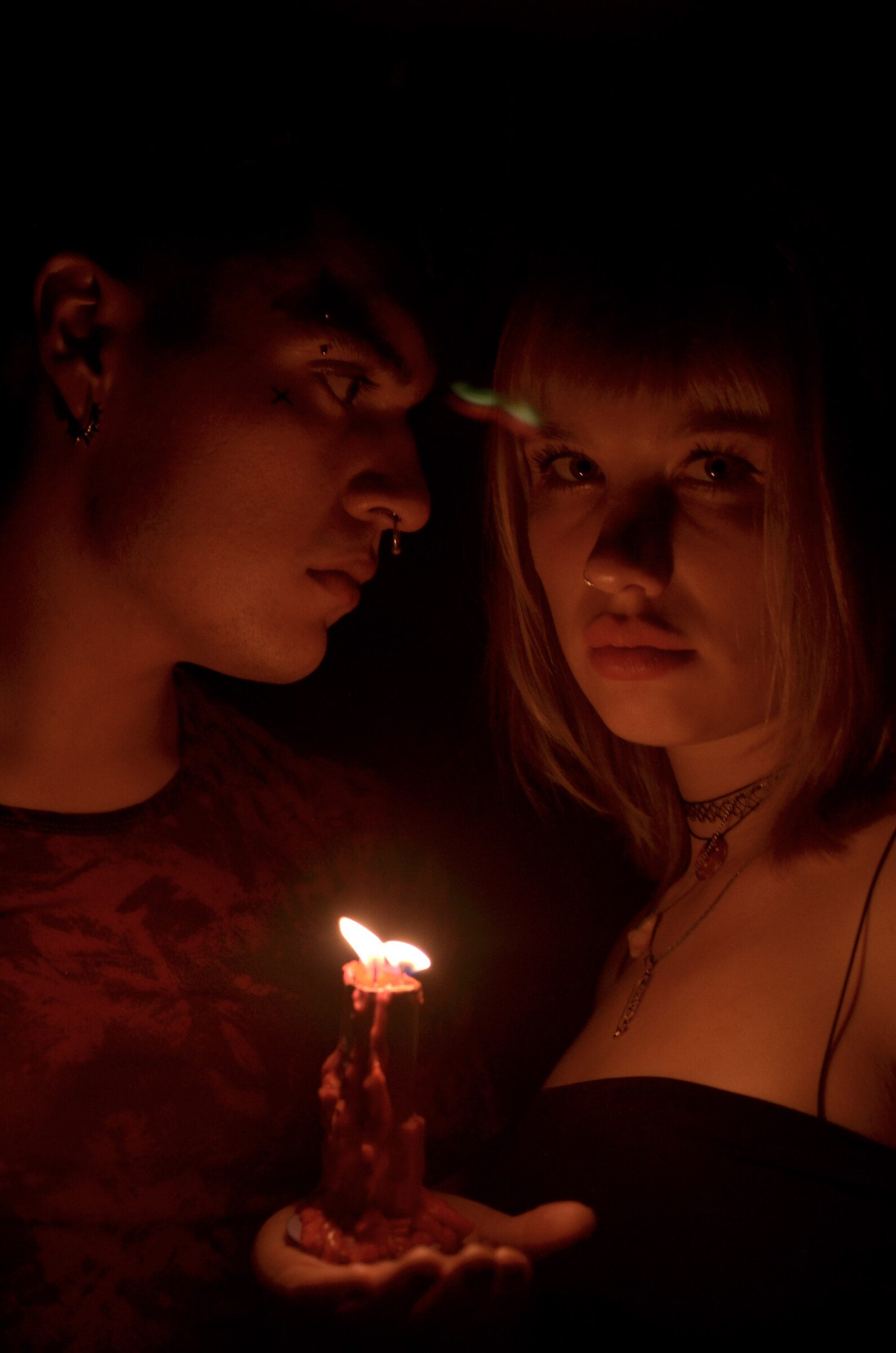 Two faces over a single flame