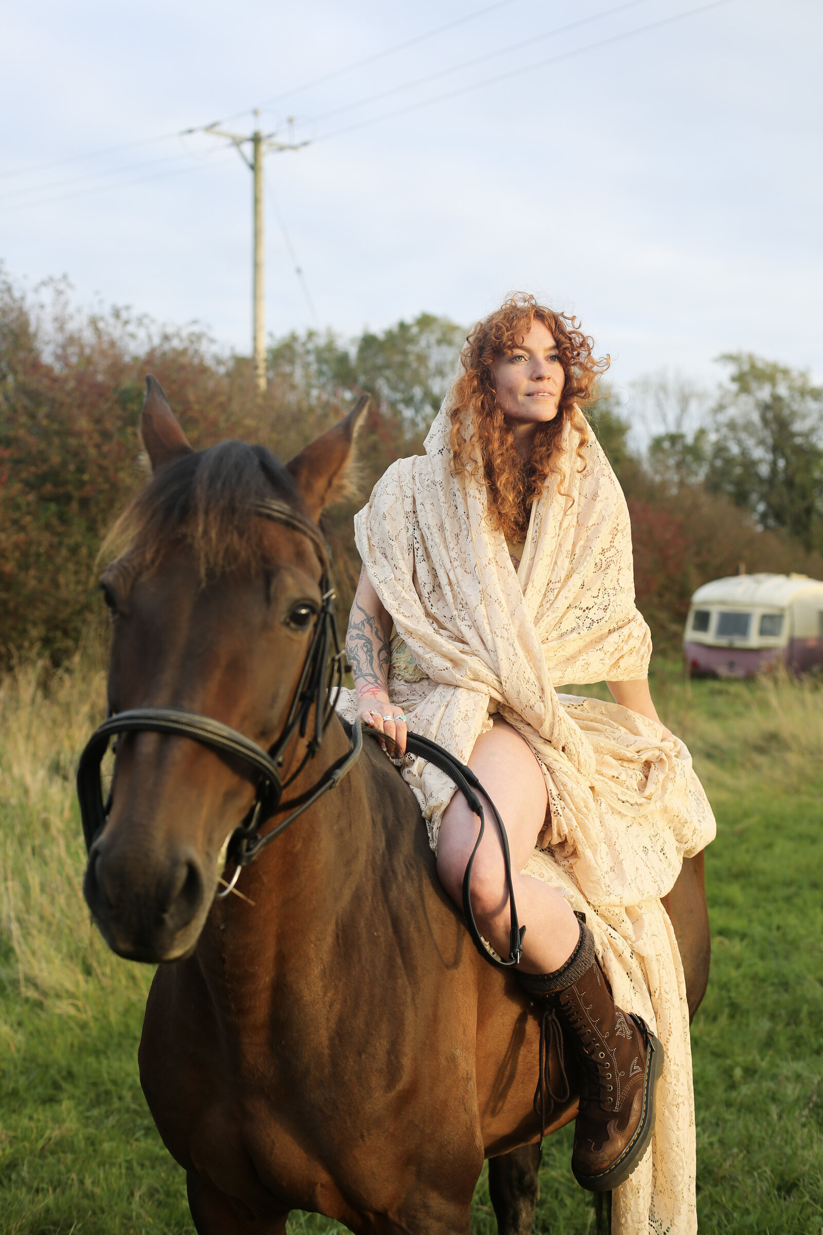 Model in a gown on horseback, golden field
