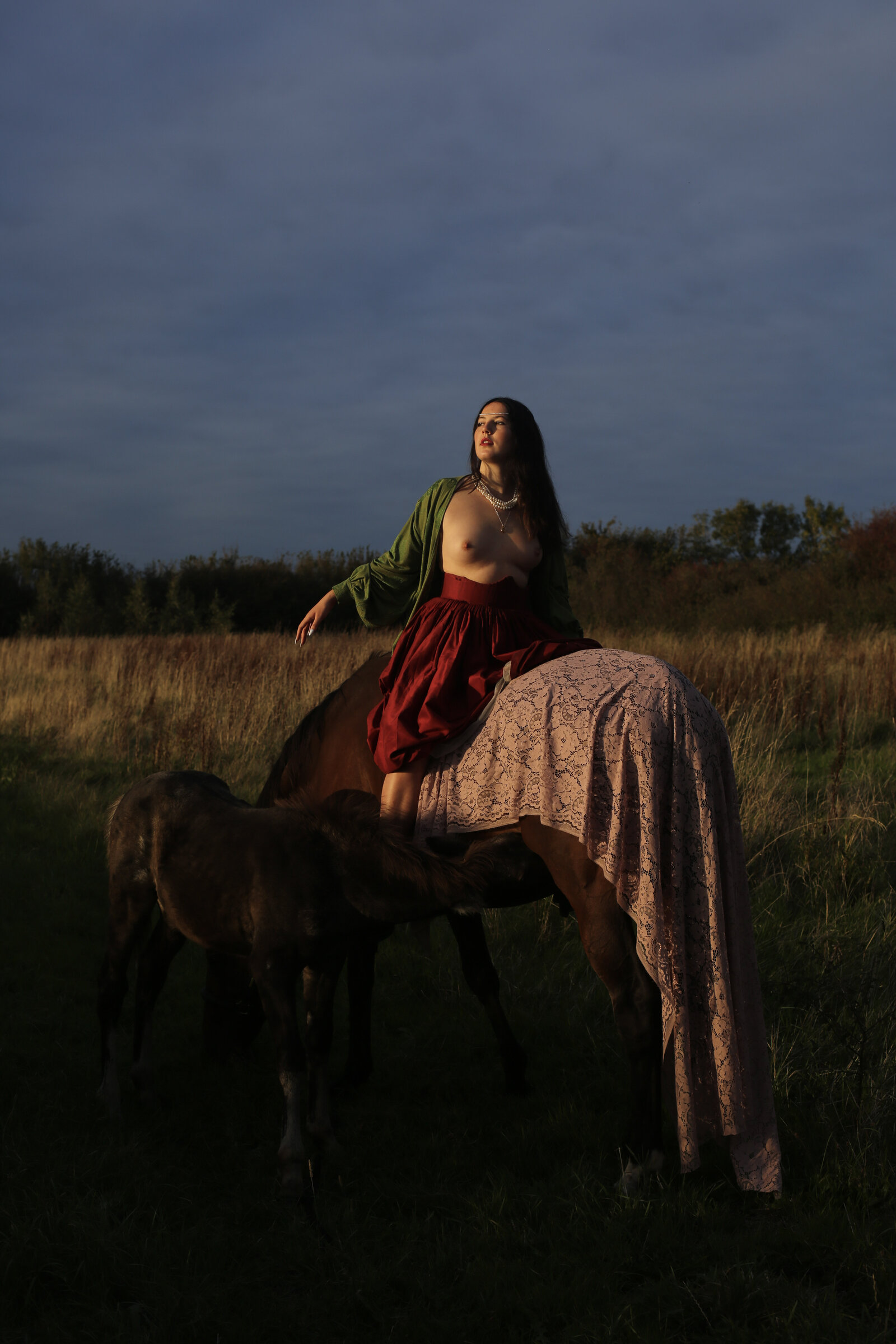 Rider in lace against a storm sky