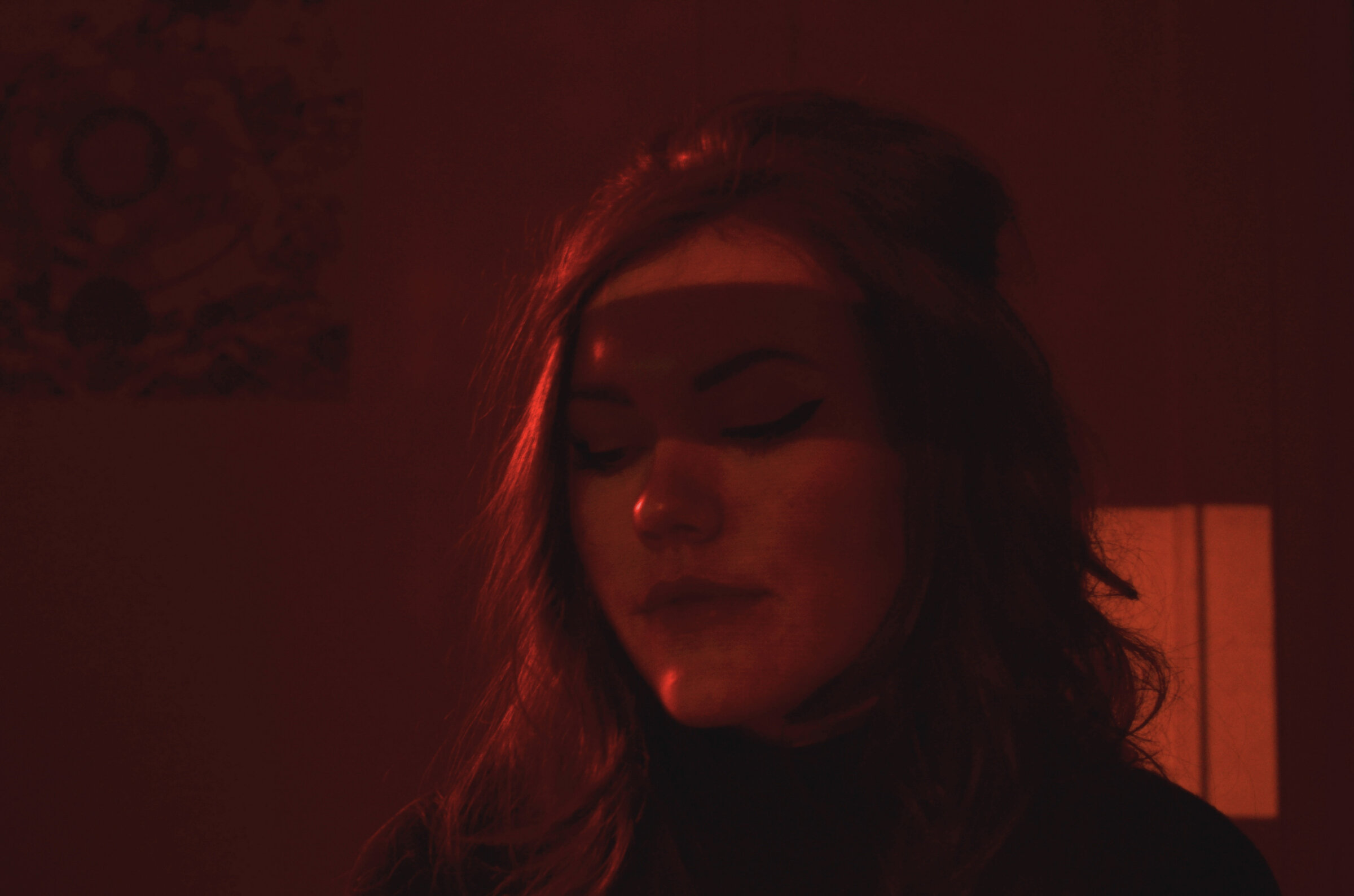 Portrait washed in red gel light
